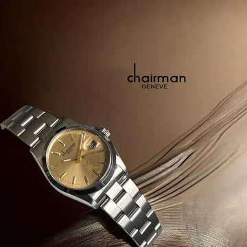 Chairman Geneve Oman Emblem Dated Golden Dial Silver Chain Gents Watch